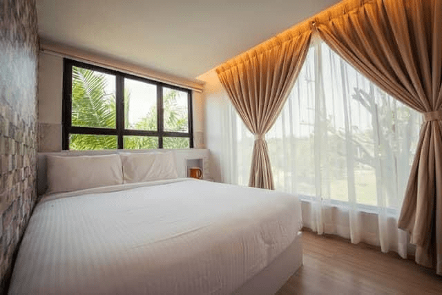sinar eco resort container room interior with queen size bed